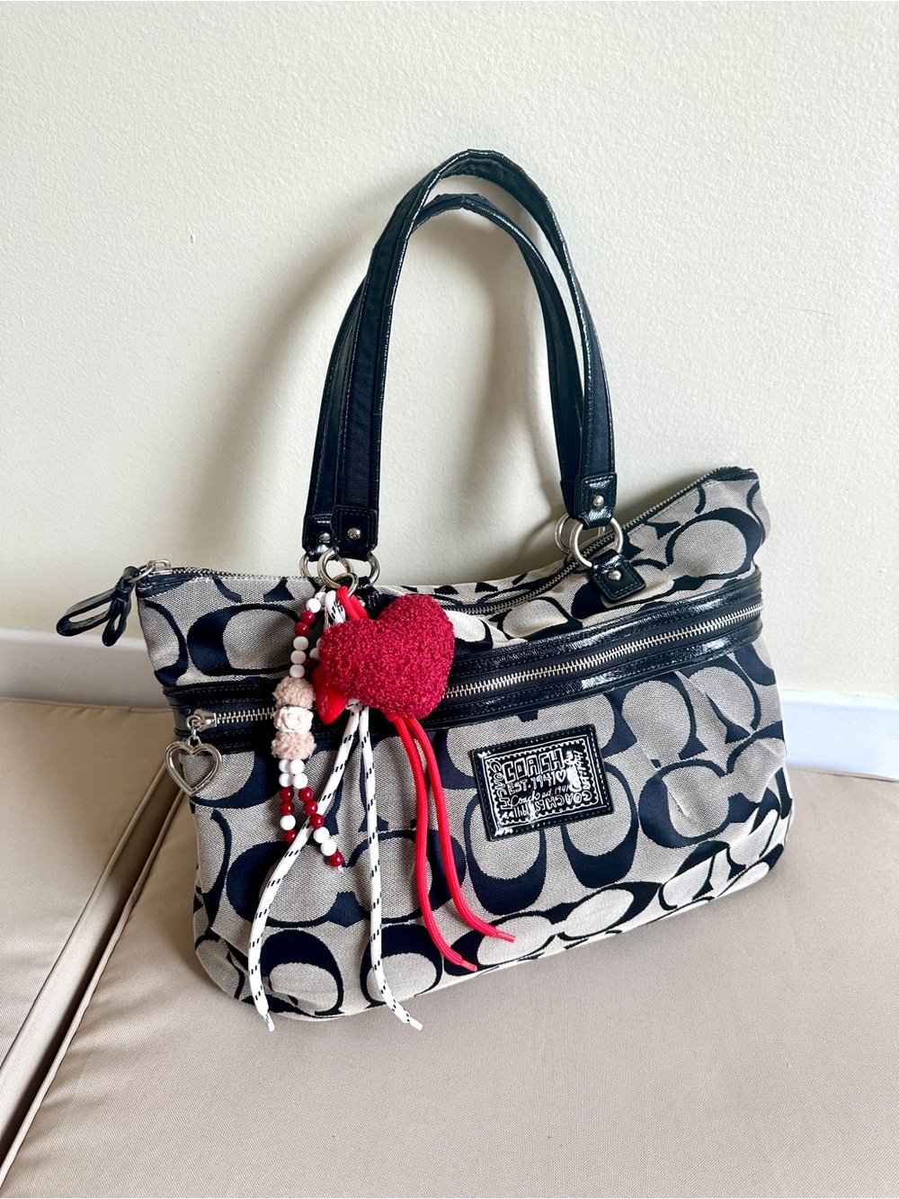 Coach Signature Canvas Shoulder Bag with Black Handles and a Charm
